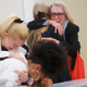 Victoria Valentino hugs Therese Serignese on the right, and Caroline Heldman and Lili Bernard react after the guilty verdict.